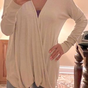 Lovestich sweater with a front wrap draped style.